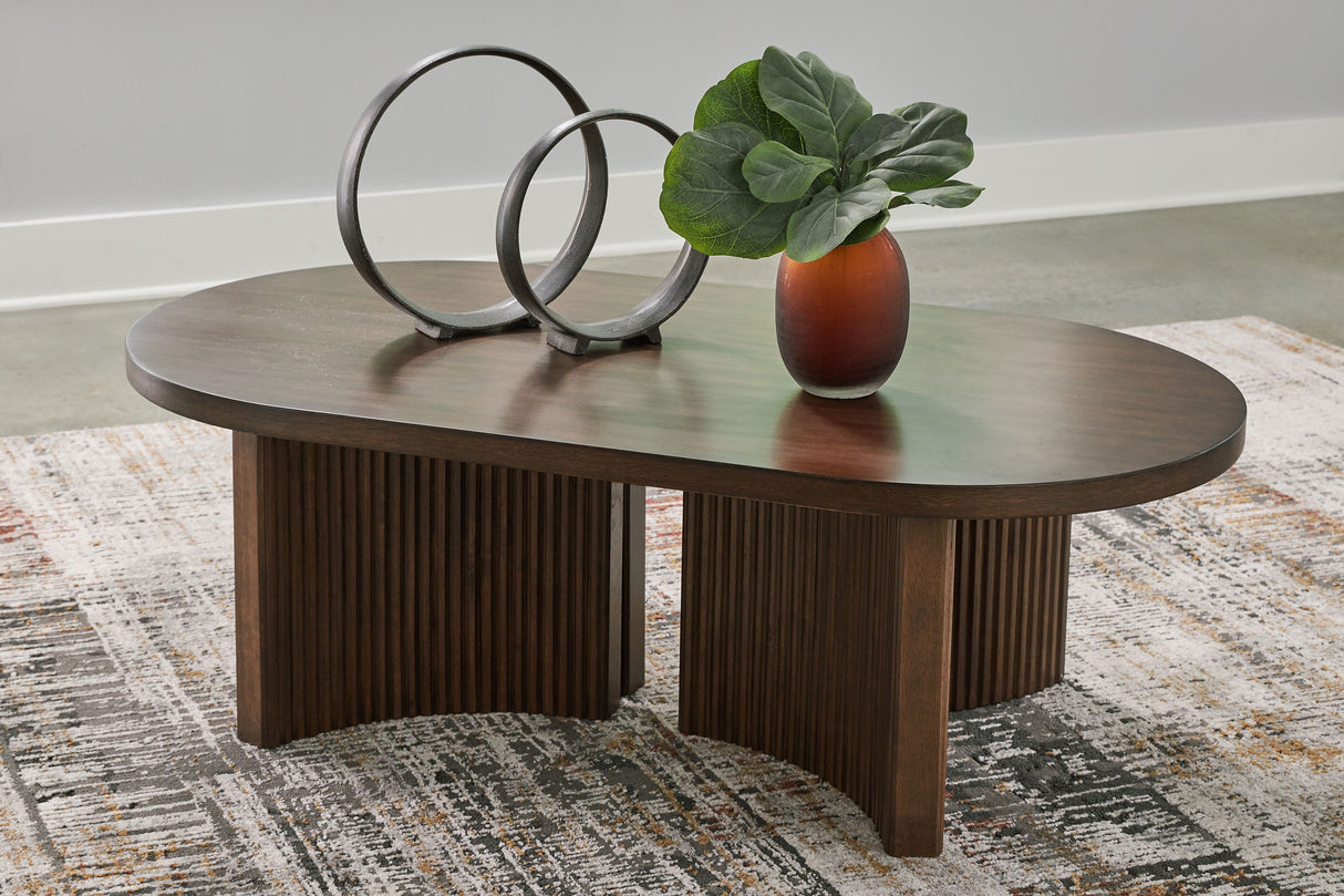 Korestone - Oval Cocktail Table - Dark Brown